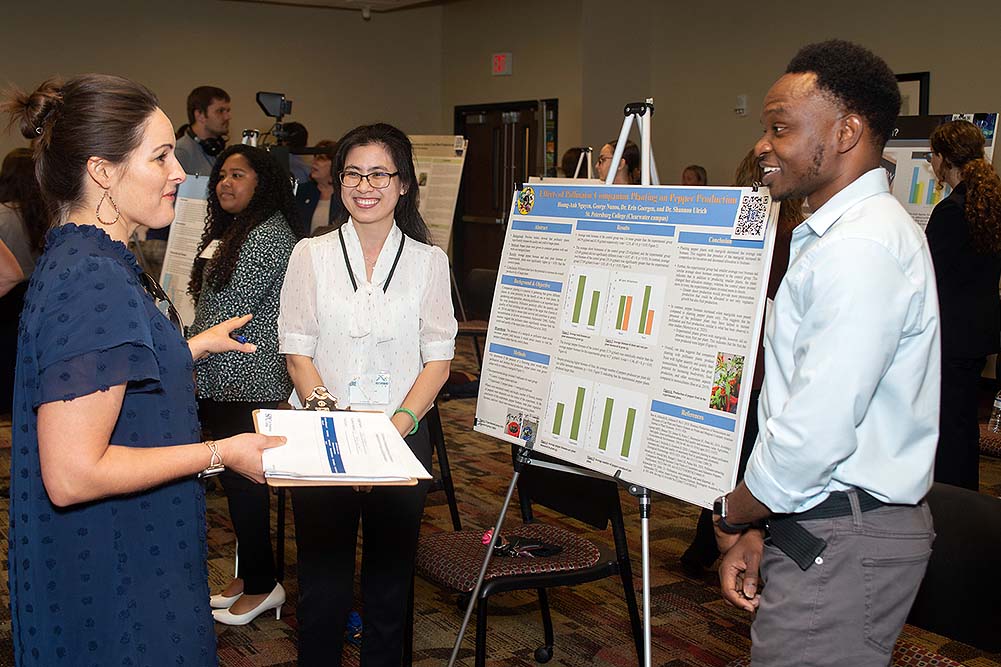 students discussing their research projects