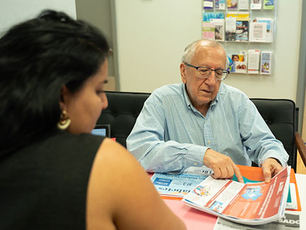 Jose Heinert works with Carolyn Otero Torres