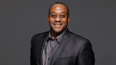 portrait of CCIT dean Dr. Mark McKinney wearing a dark gray suit and a smile