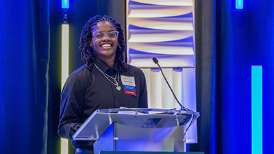 St. Petersburg College student and basketball player Celine Forine speaking at donors and scholars luncheon