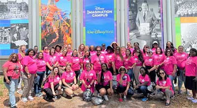 conference attendees wearing pink shirts