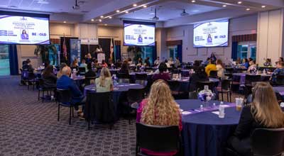 conference attendees listening to presenter