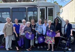 donors gathered in next to a bus