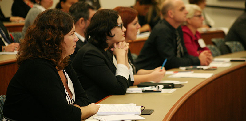 group of people sitting at a dais