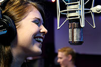woman singing at a microphone