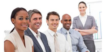 A corporate team sitting at a conference table.